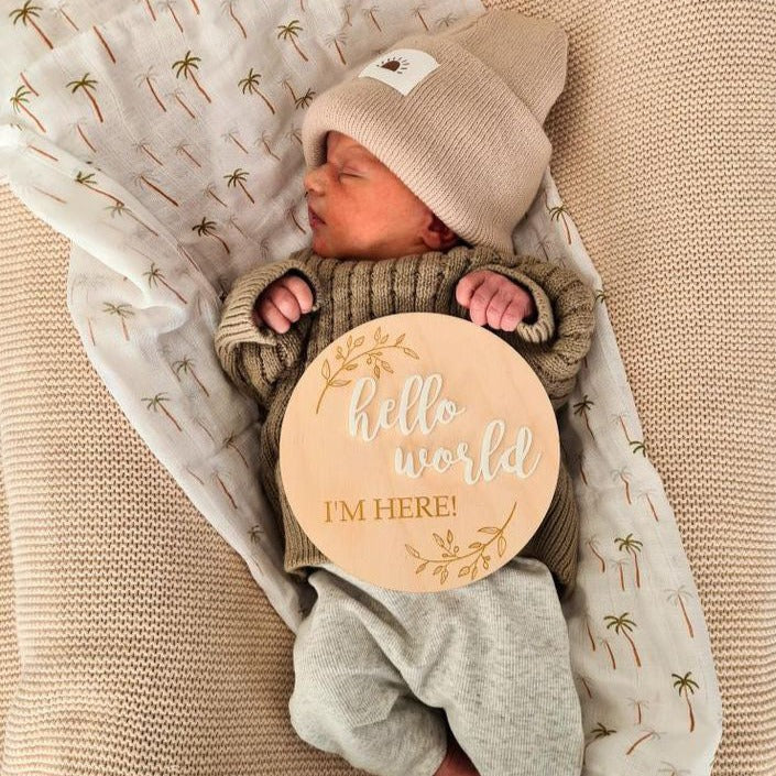 Hello World I'm Here Announcement Pictured on a Baby