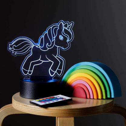 Unicorn Night Light on a stool with the remote